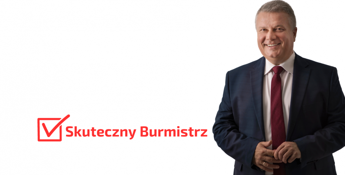 Uśmiechnięty mężczyzna w marynarce i bordowym krawacie, obo napis "Skuteczny burmistrz"