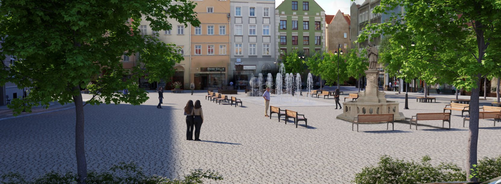 Widok rynku w zieleni drzew, w dalszym planie fontanna i kamienice
